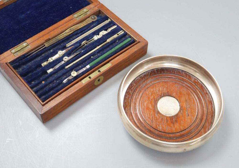 A mahogany box containing drawing instruments